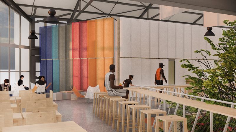 Le Food Hall intègre une diversité d’assises en bois clair et en métal accompagnées d’un mobilier coloré « pour proposer une autre manière de se restaurer ». Ici, une vue de la mezzanine. Crédit : VOUS/Lucas Auton.